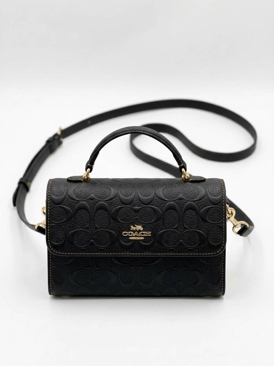 کیف دستی و دوشی زنانه کوچ (Coach) مدل Top Handle با چرم مونوگرام برجسته